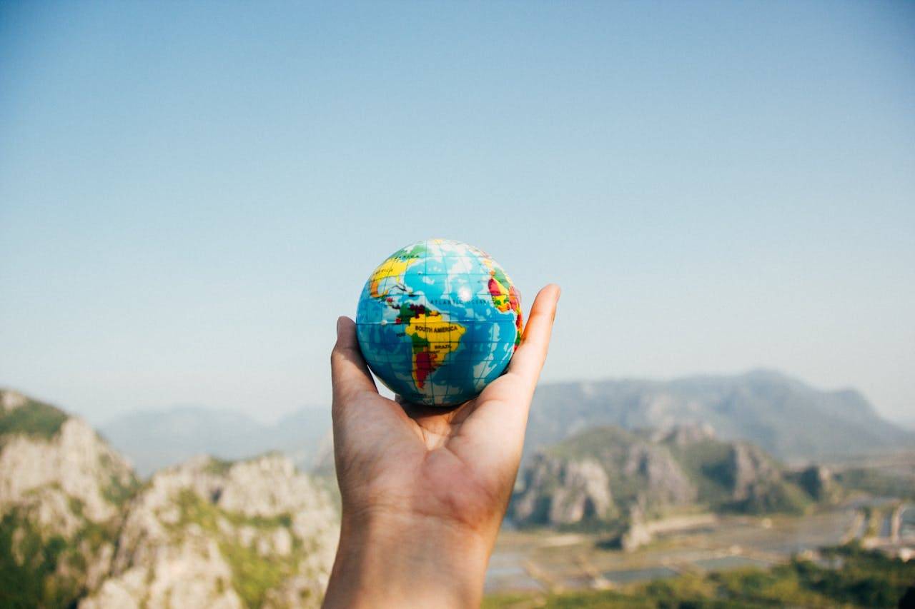 Blue globe on a rock with views of Daedunsan Provincial Park landmark.